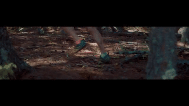 Man runs through woods
