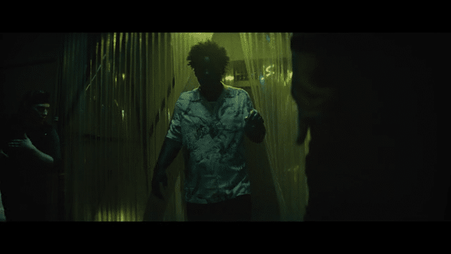 Does a sweet 360 turn, grabs a gun and begins firing as we change from live action to anime